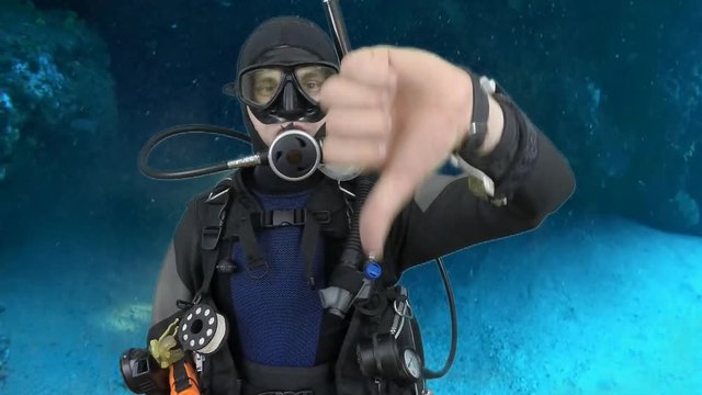 Scuba diving instructor shows signal - Descent