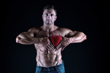 Fototapeta na wymiar Treat your heart with love. Strong man hold red heart. Giving heart for valentines day. Cardiovascular health. Healthy diet. Heartache and chest pain. Healthcare. Keep your heart healthy