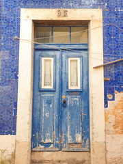 Fototapeta na wymiar Lisbon traditional tile and door