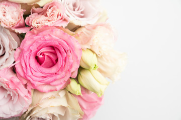 Pink roses and lisianthus flower bridal bouquet floral background