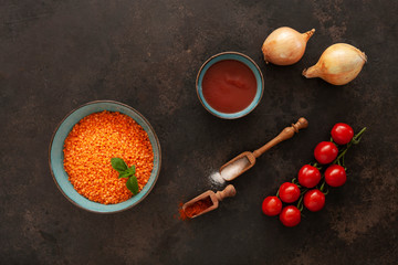 Red lentils, tomatoes, onion, tomato paste and spices, ingredients for cream soup cooking