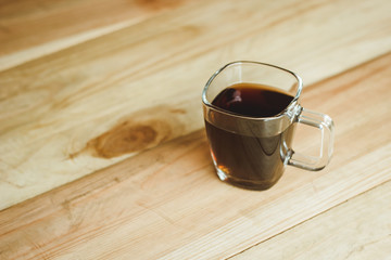  small cup of coffee on a wooden table