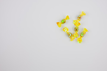  Yellow candies with white background