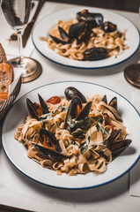 Pasta with mussels and herbs, restaurant dish
