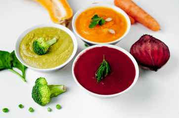 Set of vegetable soups. Soup from broccoli, spinach, green peas. Pumpkin and carrot soup. beetroot...