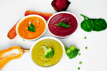 Set of vegetable soups. Soup from broccoli, spinach, green peas. Pumpkin and carrot soup. beetroot - carrot soup on a white background isolated