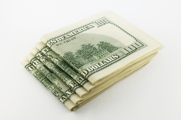 Stack of american money, one hundred dollar cash banknotes on white background, lot of one hundred dollar bills