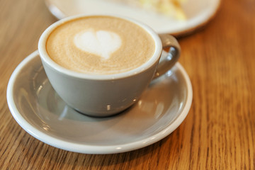 Coffee cup fresh cream organic cappuccino on table in cafe