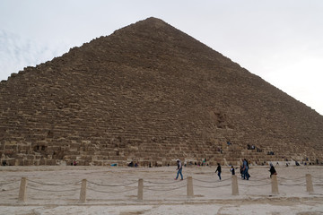 Fototapeta na wymiar Tourists near Great Pyramid of Giza in Egypt
