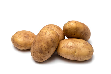 raw dirty potatoes on a white background