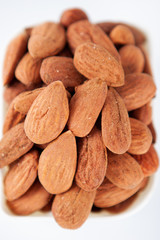 Group of almonds on white background