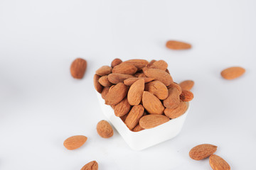 Group of almonds on white background