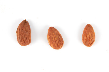 Group of almonds on white background