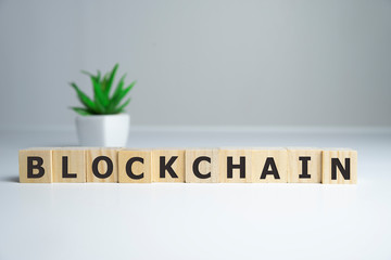 Block chain - word from wooden blocks with letters, blockchain concept, gray background