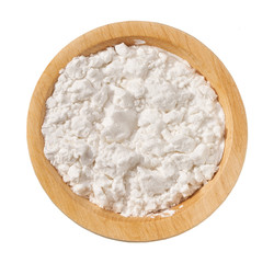 Wooden  plate with potato starch isolated on a white background. Top view.