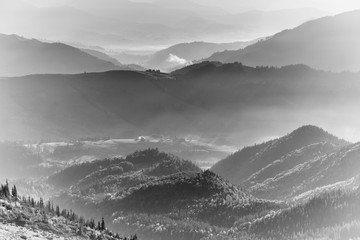View of the top on fantastic sunlight of beautiful scenery mountains range at sunrise. Layers of...