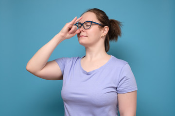 woman practicing hatha yoga nadi shodhana pranayama or alternate nostril breathing