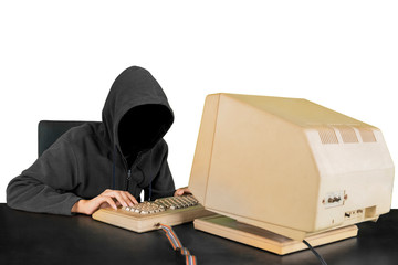 Hacker wearing hoodie using computer