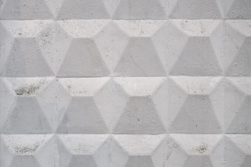 vintage background of an old concrete wall with relief volume pattern