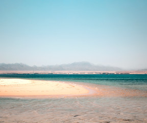 Summer photo of beach with sea and sunny warm day 