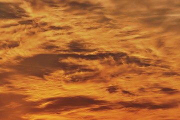 Background with sky and clouds in flames, at sunset. 