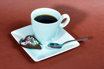 white cup of coffee and gingerbread cookies.