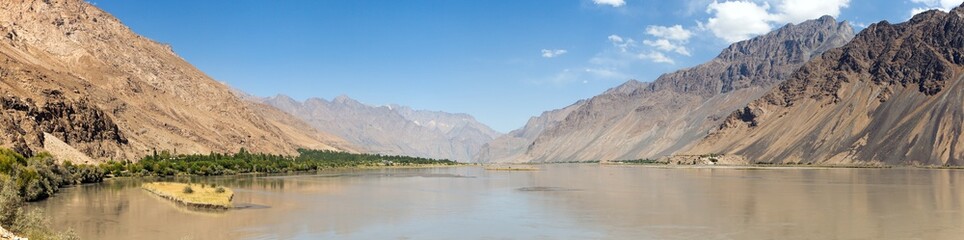 Fototapeta na wymiar Panj river and Pamir mountains panoramic view