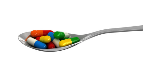 Pills in spoon