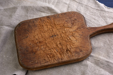 empty brown very old vintage kitchen cutting board with handle