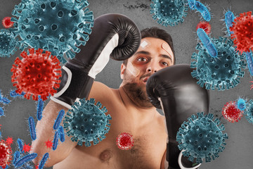 Man fights like a boxer. Concept of viruses and bacteria attack