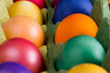 Fototapeta na wymiar colorful easter eggs in egg box