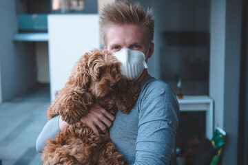 Man wearing FFP3 face mask respirator with dog