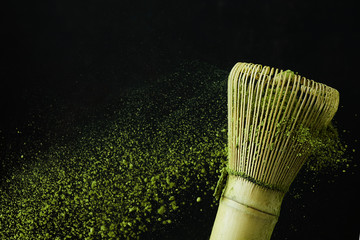 Japanese matcha green tea for healthy lifestyle design. Organic green tea matcha powder splash.