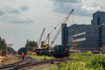 Fototapeta na wymiar Freight trains with cargo on railroad junction