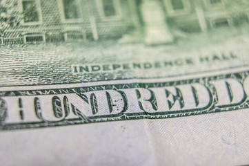 Element of American cash banknote 100 dollars. Macro photography