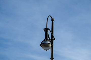 old street lamp on blue sky
