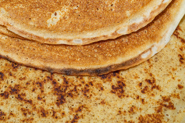 Thin pancakes close up texture background