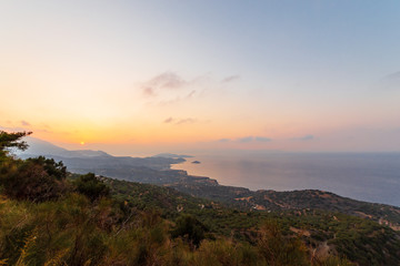 Crete island beach and mountains in sunset time. Greece vacation.