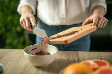 shot of woman cutting chocolate