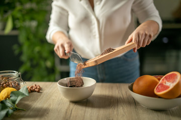 shot of woman cutting orange 
