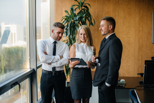The staff in the office to discuss business matters next to the window. Business, Finance