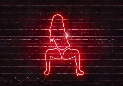 Neon sign on a brick wall in the shape of a stripper girl.(illustration series)