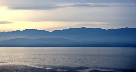 Thunderclouds and rain clouds over the coastline of the Strait of Juan de Fuca. Pacific Ocean.