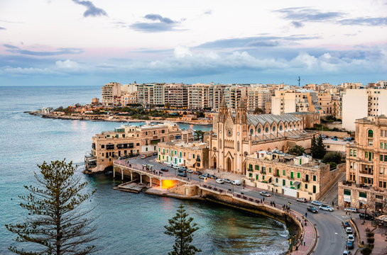 Sliema / Malta - February 22, 2015: View of Balluta Bay from the 12th floor of Le M&eacute;ridien Hotel. The skyline is dominated by the Carmelite Parish Church (Church of Our Lady of Mont Carmel).