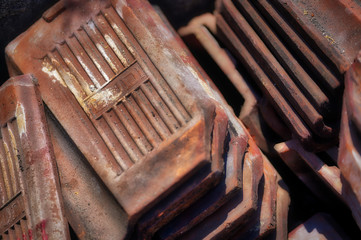 Clay tile shingles are stacked waiting for roof construction in Bali, Indonesia.                           