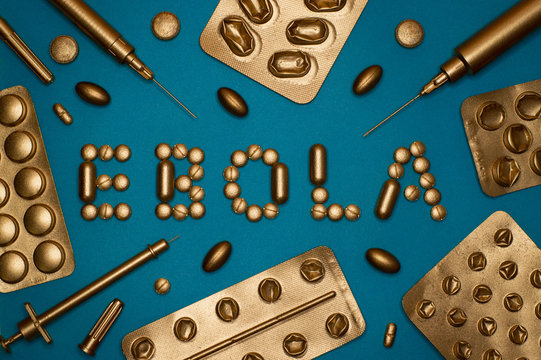 ebola word and blister packs on blue background