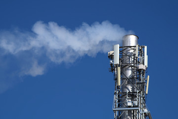 air pollution chimney and smoke on blue sky co2 emission environment climate change