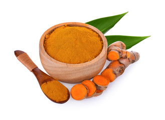 turmeric rhizome and powder in bowl and spoon wooden on white background