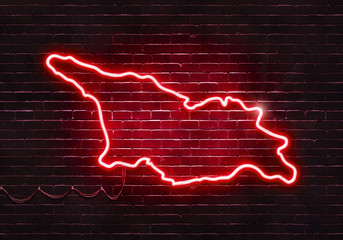 Neon sign on a brick wall in the shape of Georgia.(illustration series)
