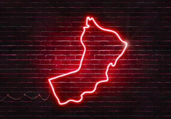 Neon sign on a brick wall in the shape of Oman.(illustration series)